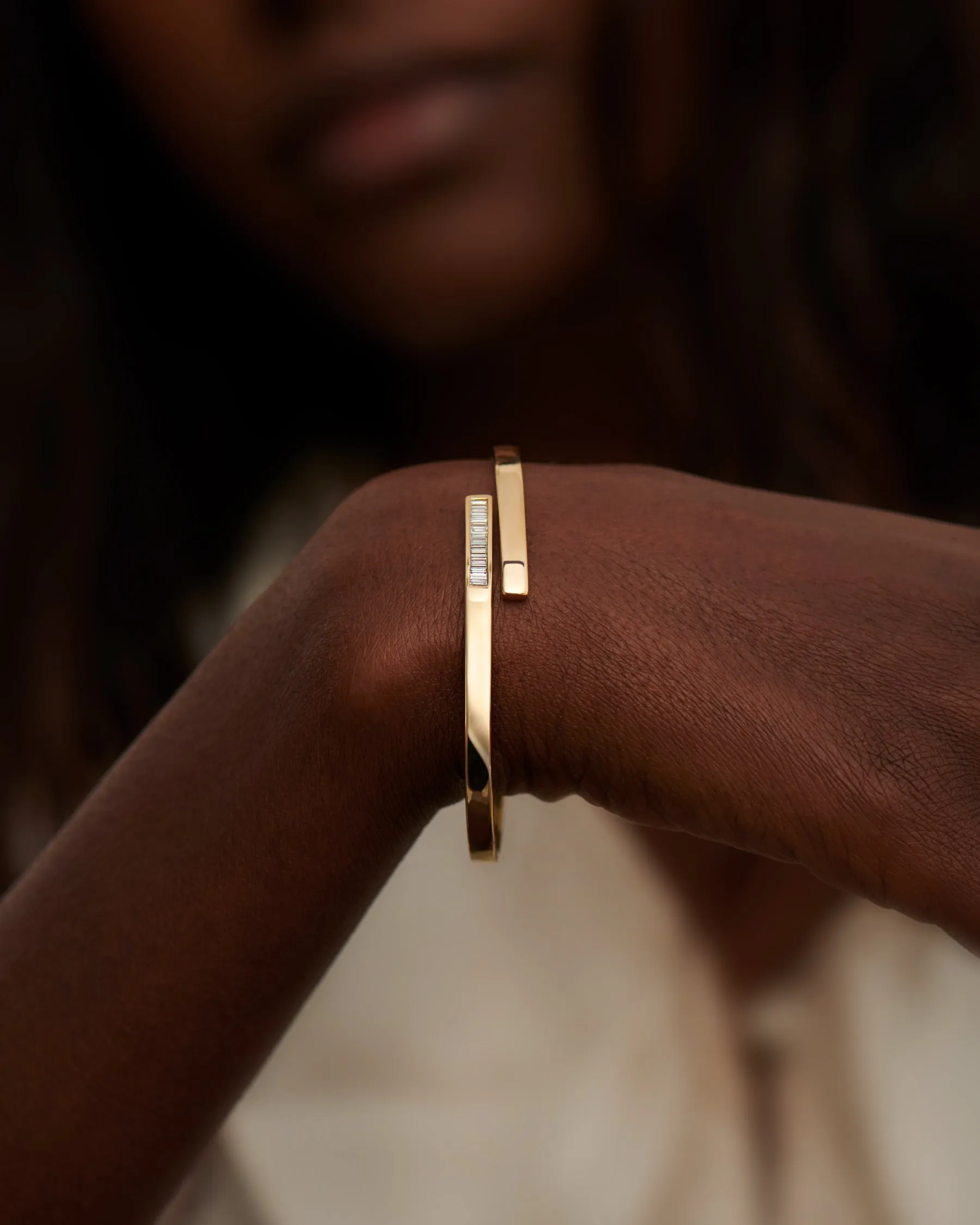 Golden Spiral Bangle with Inlaid Baguette Diamonds