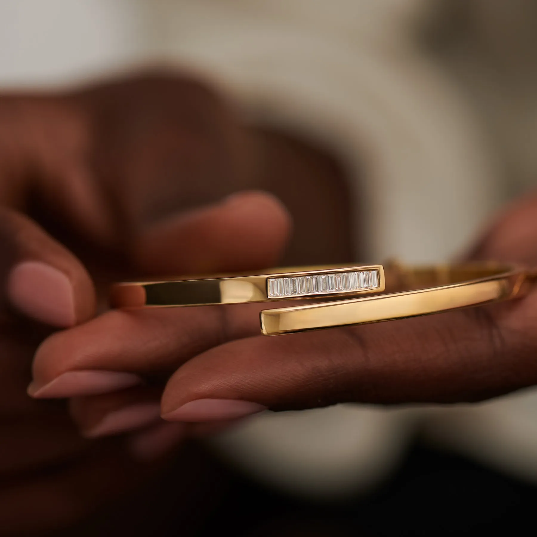 Golden Spiral Bangle with Inlaid Baguette Diamonds