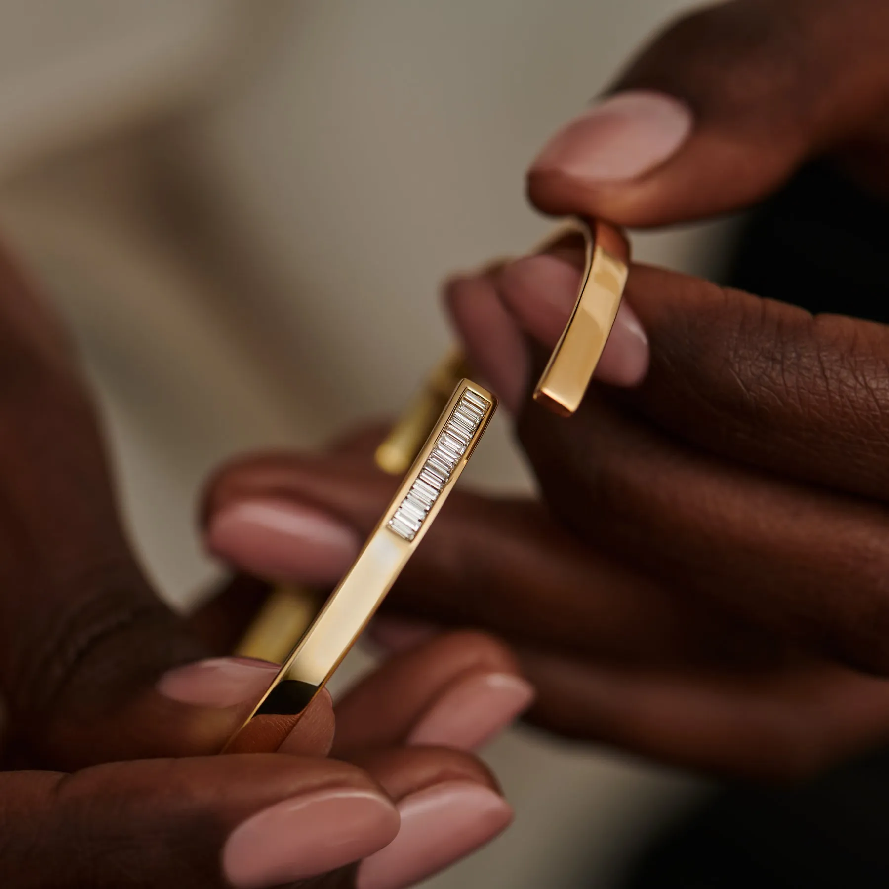 Golden Spiral Bangle with Inlaid Baguette Diamonds