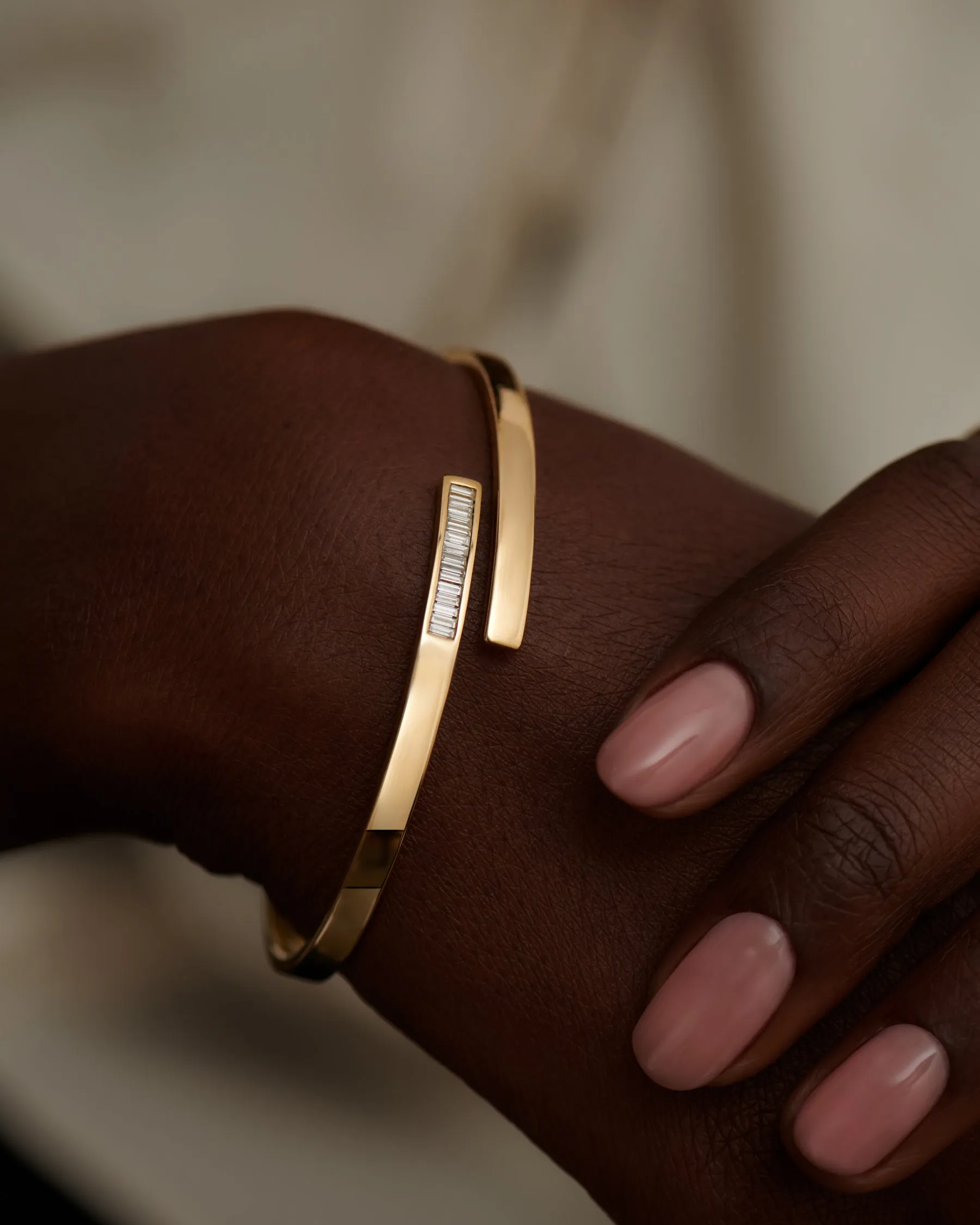 Golden Spiral Bangle with Inlaid Baguette Diamonds