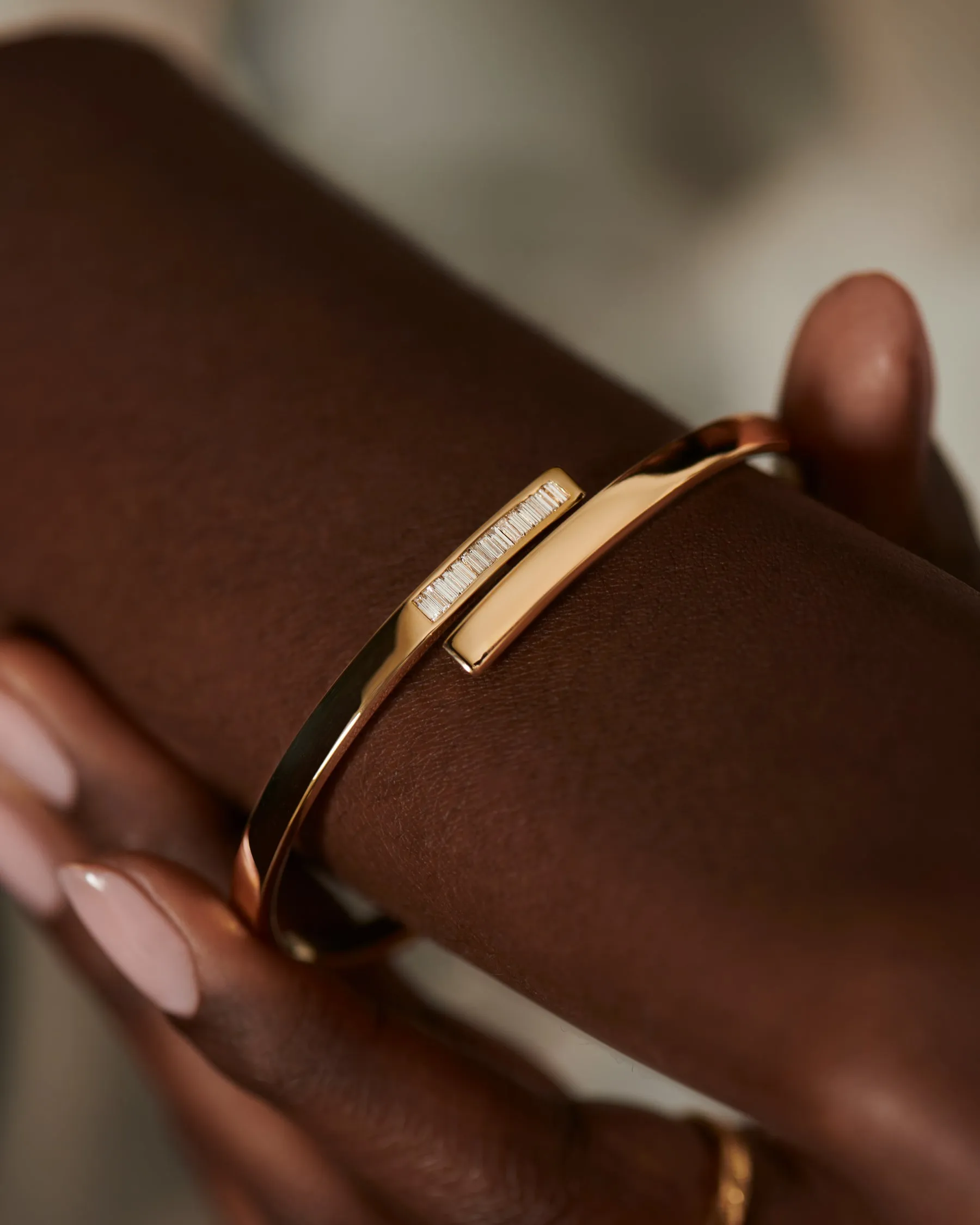 Golden Spiral Bangle with Inlaid Baguette Diamonds